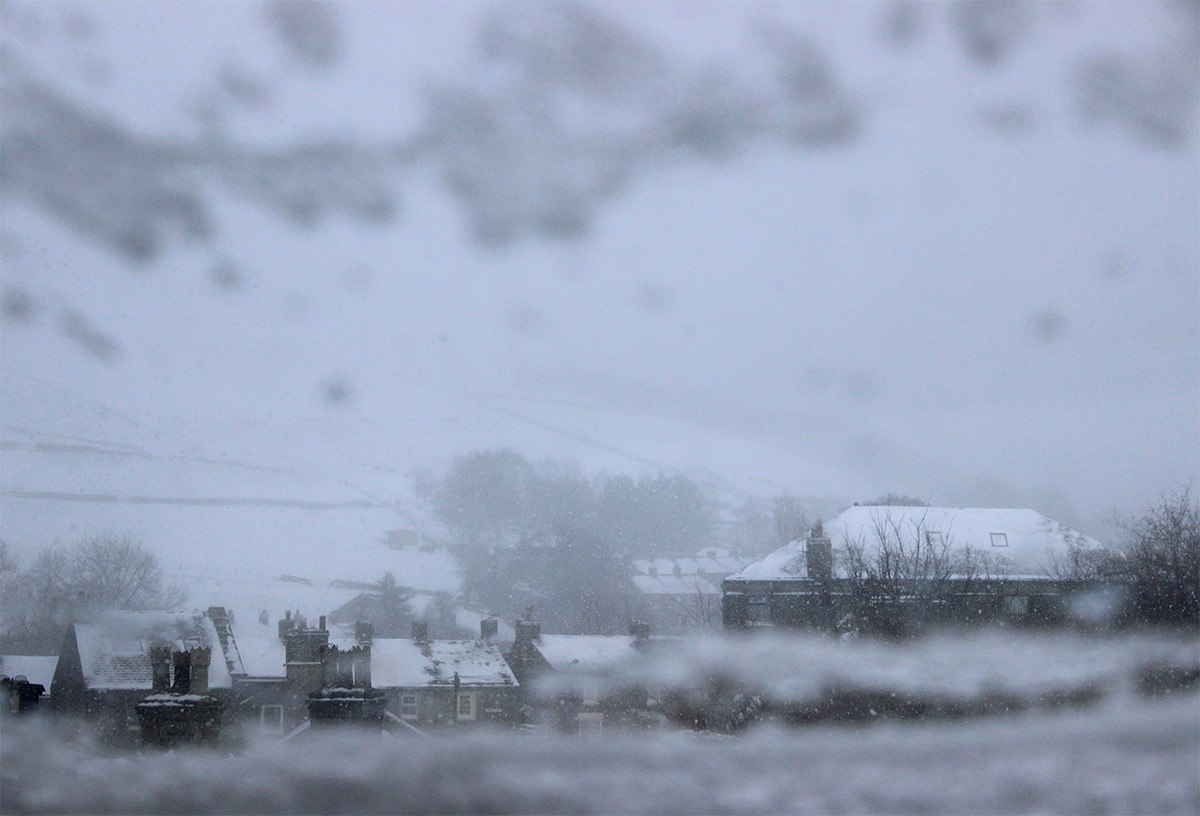 Hayfield Snow from Window - Photo of heavy snow across Hayfield Village in the Peak District - photo by gavstretchy