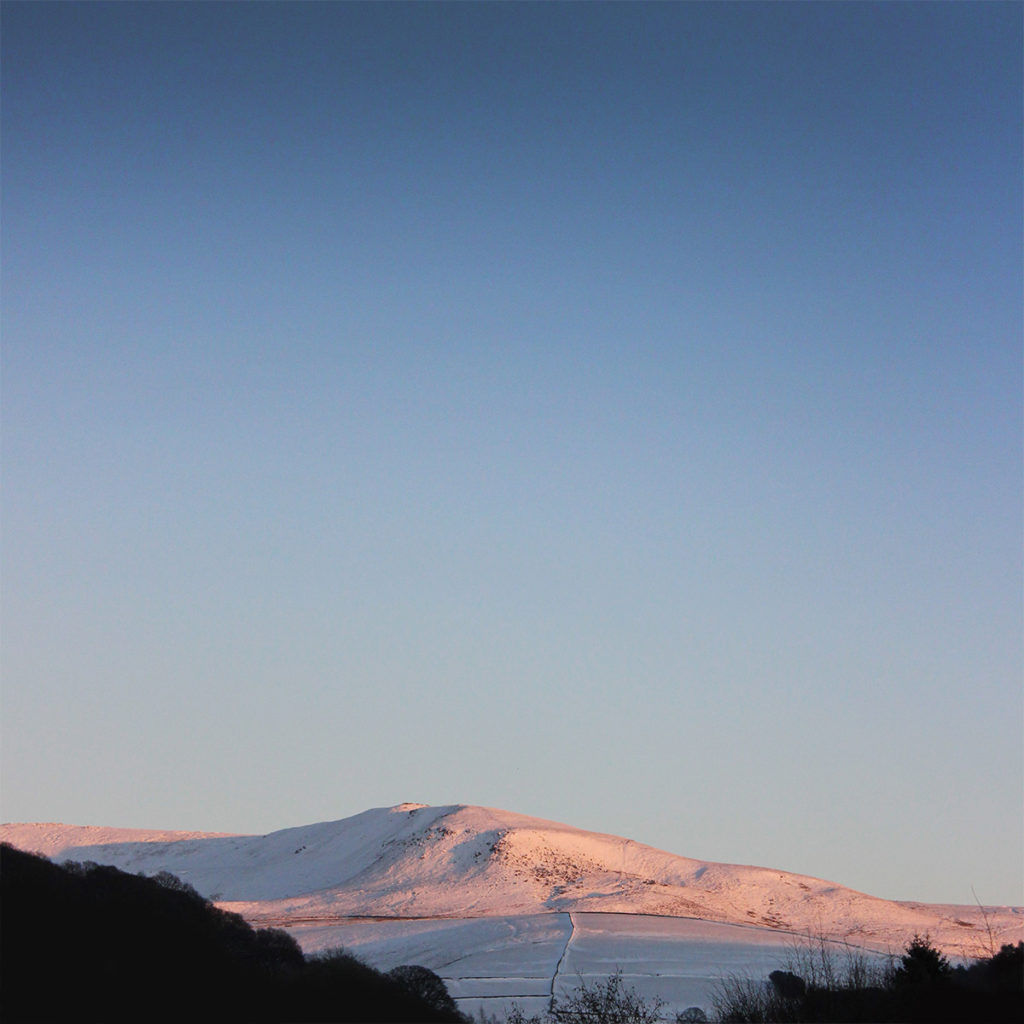 Kinder Orange Snow - Photo of Kinder Scout in the Peak District covered in snow with orange light form the sunset - photo by gavstretchy